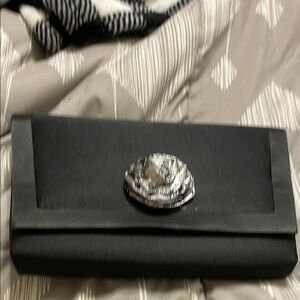 Sleek Black and Silver Clutch with Statement Closure